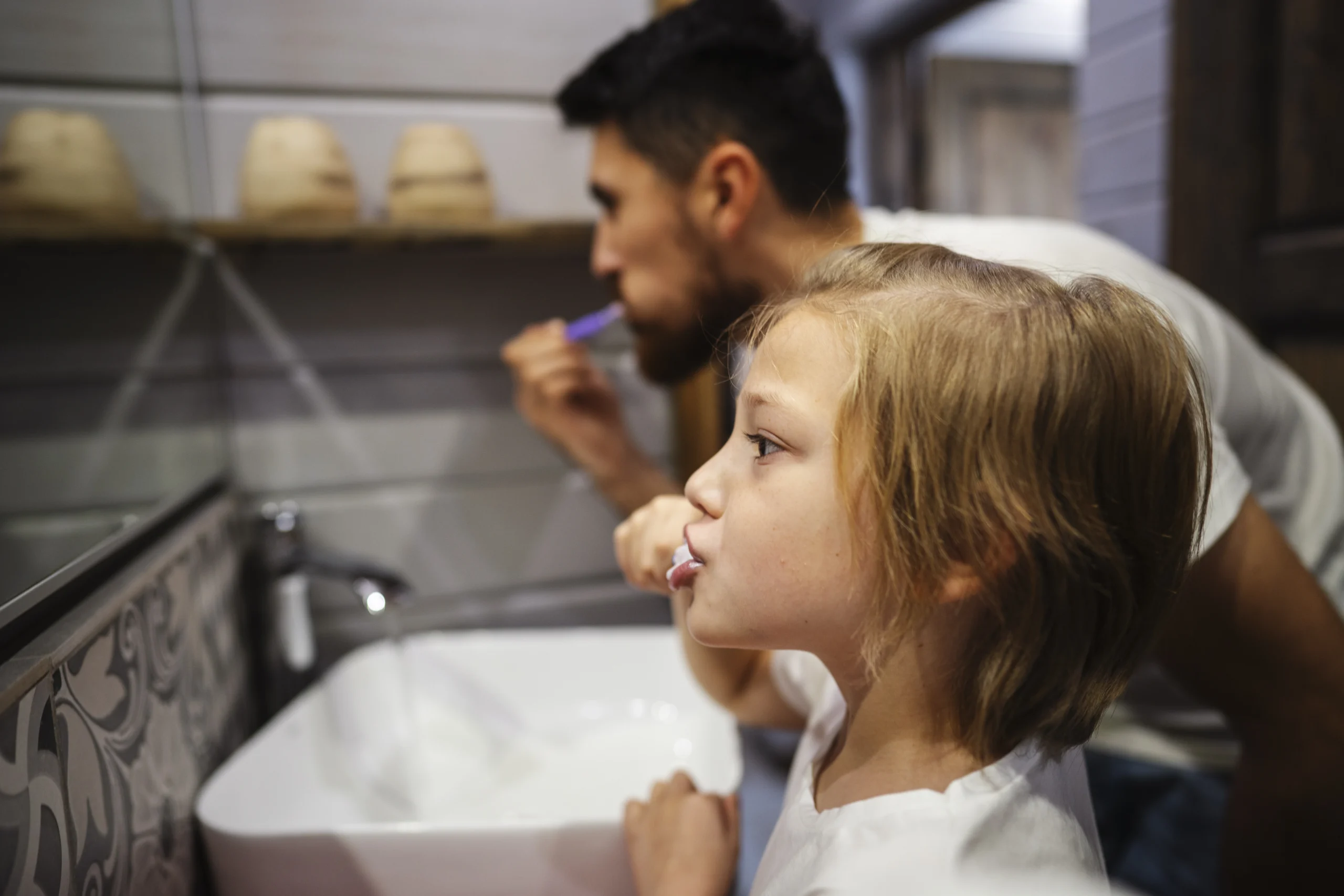 Parent supervising a childs toothbrushing in Winmalee